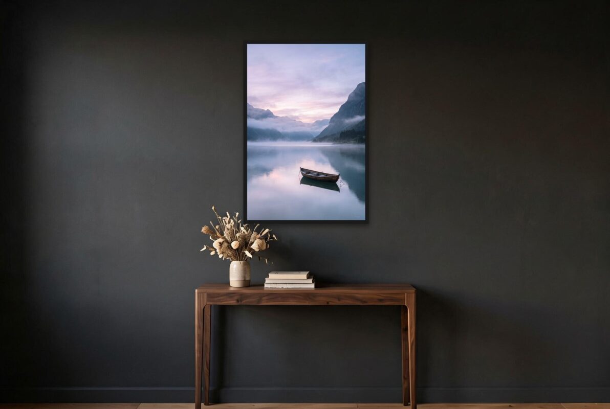 Black framed fjord art print on a dark hallway wall